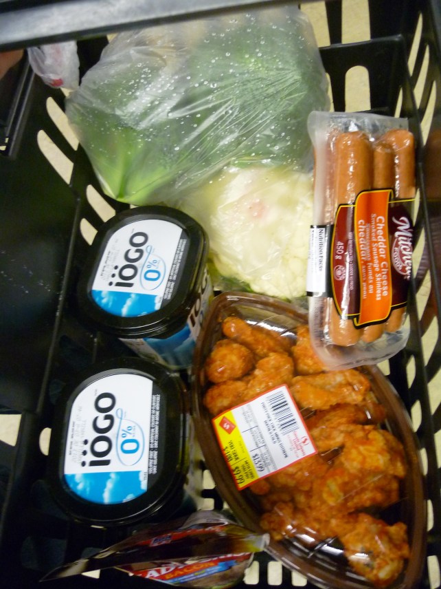 Gratutitous food shot: yogurt, veggies, cheese-filled wieners, wings in a football-shaped container.  As you can see, nothing but the best for us!