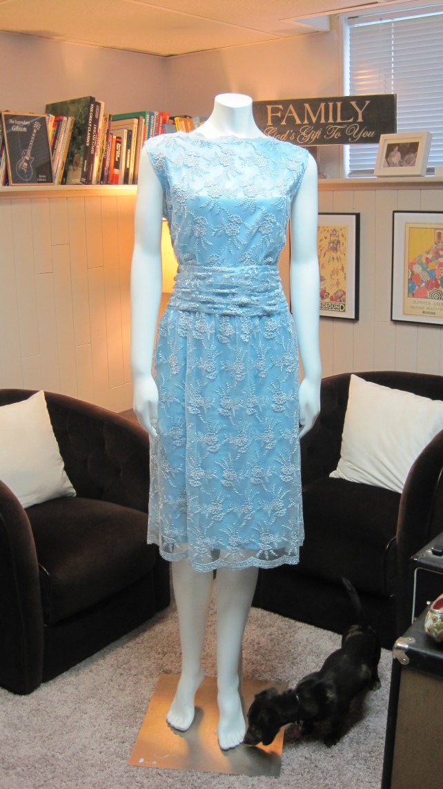 I had my seamstress shorten the dress, but keep the scalloped hem.  She also took off the sleeves.