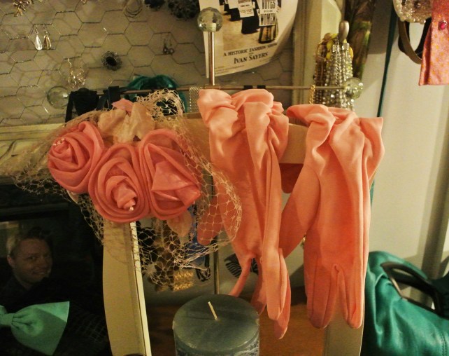 Some vintage pink gloves and a fascinator on my dressing table.