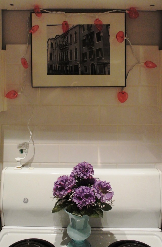 I got these heart lights at Target for $1, and they've been lighting my stove hole up for over a month.  This morning though?  They died.  How ironical, right?