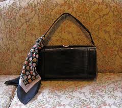 This scarf makes a plain black bag look special!  And don't worry about matching it to your outfit, the contrast can be interesting.