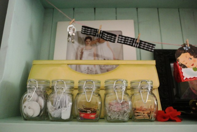 The tiny jars hold my tiny things, like baby clothespins, price labels, safety pins and tacks.