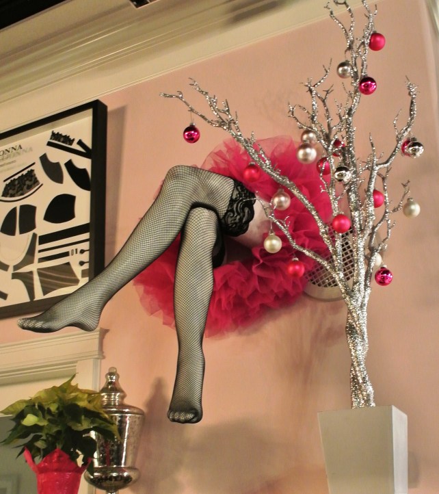 A lady is NOT trapped in the wall, it's a mannequin.  So don't worry.