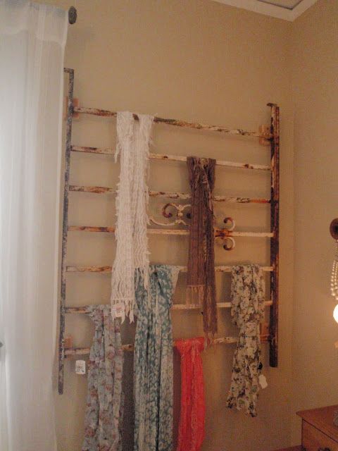 Great idea for storing and displaying scarves: use an old iron headoard