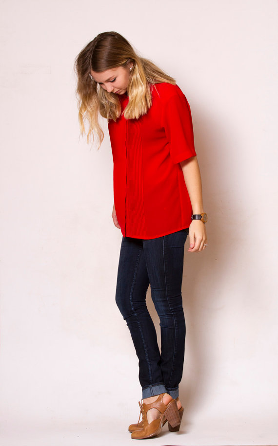 Red short sleeve blouse.