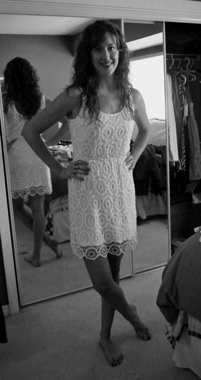 The dress in question: white lace perfection!!! I'd love to see it dressed down with a jean jacket and sandals for summer, black tights and a leather jacket for winter.