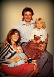 Here's a family picture just after my brother Tyler was born.  How stylish is her black and white striped sweater and red skirt, right?  I'd wear that now!